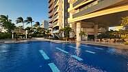 The pool between building and beach