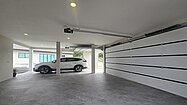 Two automatic roller garage doors for 3 cars