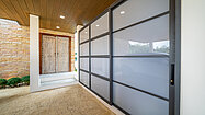 The entrance door and laundry, storage room