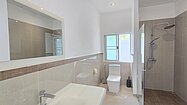 There are 2 modern bathrooms