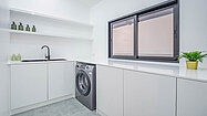 A separate working, laundry and Thai kitchen room