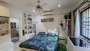 A bedroom with it`s en-suite bathroom
