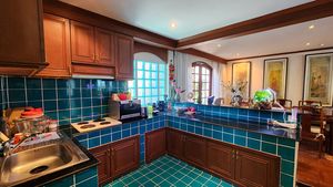 A generous kitchen with a bar counter