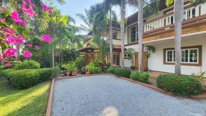 A gravel path in front of the villa