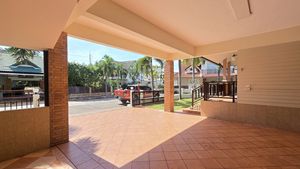 A huge carport holding 2 cars and more