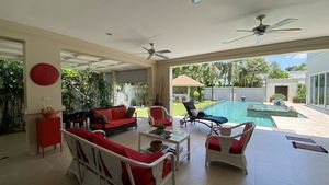 A huge covered terrace with lounge seating and sundbeds