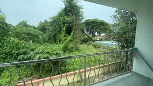 A large balcony with views to greenery