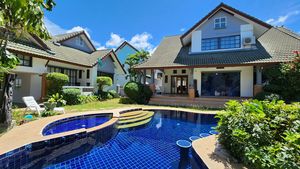 A lovely pool with bar, massage jets and a kids area