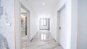 A separate hallway discreetly accessing the bedrooms
