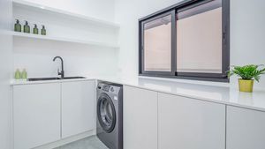 A separate working, laundry and Thai kitchen room