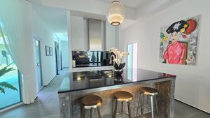 Across the kitchen island and breakfast bar