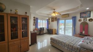 An upstairs bedroom with terrace access