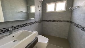 Both bathrooms are modern and alike Both bathrooms are modern and alike