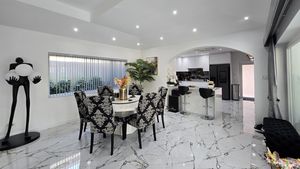 Dining-area with kitchen in the background