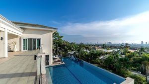 Glancing across the pool, Pattaya and the seas