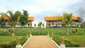 Guest-rooms seen across a lotus pond