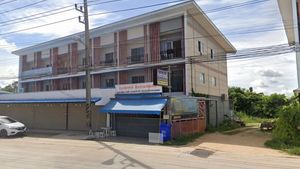 It`s the corner shophouse to the right