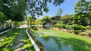 Lush walkways along cooling water