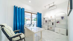 One bedroom is equipped as an office