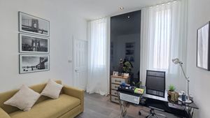 One bedroom is used as a chic home office