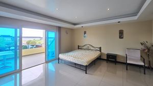 One of the two large upstairs master- bedrooms
