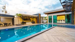 Pool with in-pool bar and outdoor leisure areas