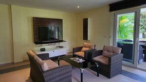 Sofa- and TV space with access to the balcony