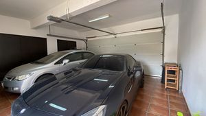 The automatic garage holds two cars