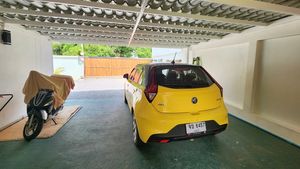 The carport easiely holding 3 cars