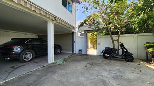 The carport holds two cars