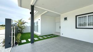 The covered carport holds 2 cars