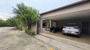 The covered double-carport with remote-gate