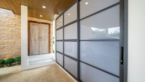 The entrance door and laundry, storage room