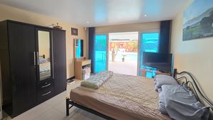 The ground-floor bedroom leading to the outdoors