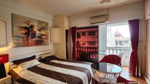 The king-size bed and a modern air conditioner