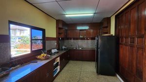 The kitchen is in a separate room