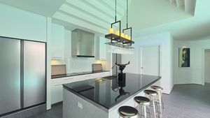 The kitchen island with breakfast bar The kitchen island with breakfast bar