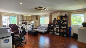 The large bedroom on top of the garage, currently used as an office and game room