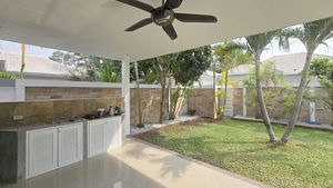 The large shaded terrace with Thai kitchen