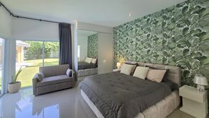 The larger downstairs bedroom