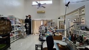 The main houses living-area is currently a tailors atelier