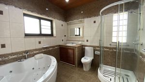 The master-bathroom offers a Jacuzzi plus shower cubicle