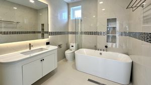 The master-bathroom offers rain shower and bathtub