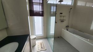 The master-bathroom with bathtub and separate shower