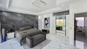 The master-bedroom with its en suite bathroom