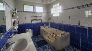 The master bathroom with a Jazuzzi tub