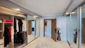 The master bedrooms walk-in wardrobe