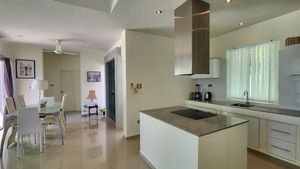 The open-plan kitchen with the dining-area