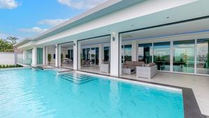 The pool and shaded terrace areas