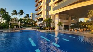 The pool between building and beach